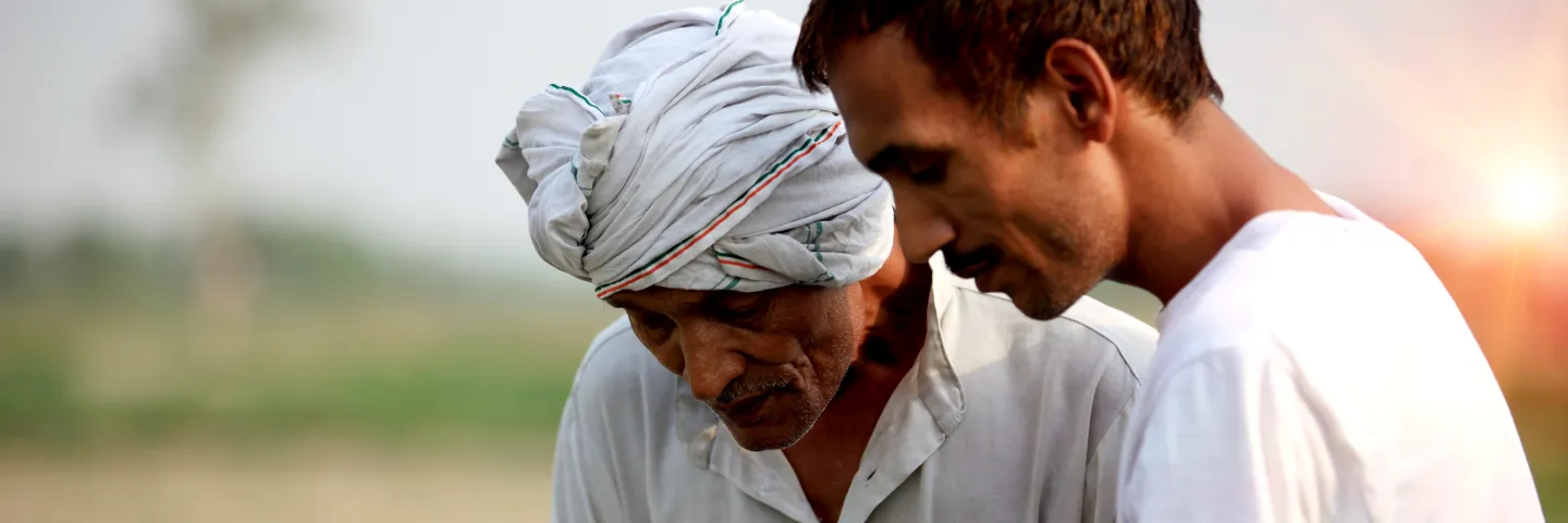 Two men looking at tablet