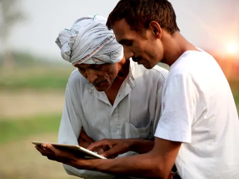 Two men looking at tablet
