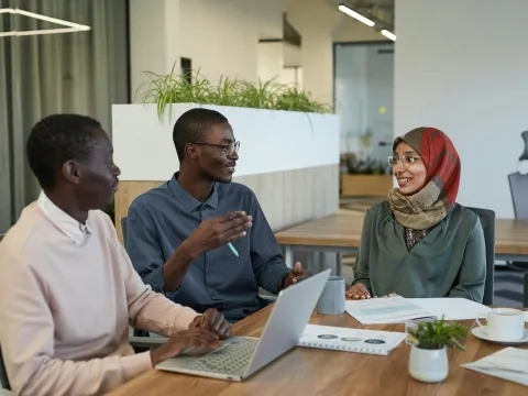 Colleagues collaborating in office