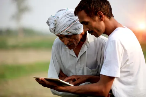 Two men looking at tablet