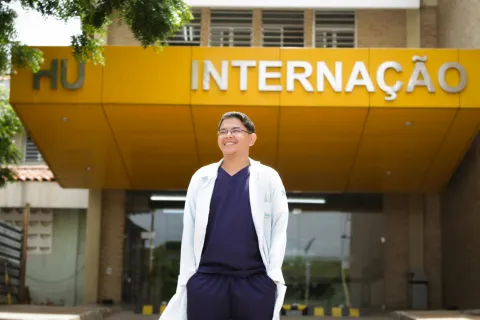 Doctor standing in front of hospital